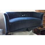 A 19th Century style blue velvet sofa