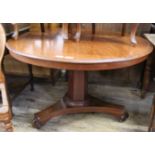 A late Victorian round mahogany dining table