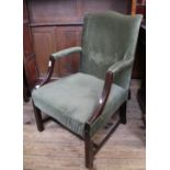 A 20th Century mahogany and green velvet armchair