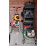 Three vintage lawn mowers,