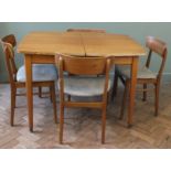A 1960's extending dining table and four chairs