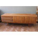 A 1960's Robert Heritage for Archie Shine sideboard with four drawers and two cupboard doors
