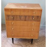A British made 1960's chest of five drawers on black legs