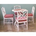 A pink painted cafe table and mock bamboo pink painted chairs