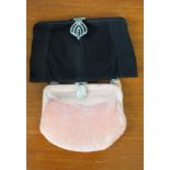 A black evening bag and a pink evening purse both with diamante clasps
