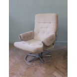 A 1970's chrome and cream upholstered swivel armchair