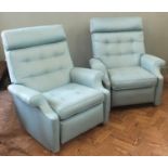 A pair of vintage pale blue Parker Knoll style recliners