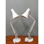 Two white anglepoise lamps