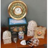 A collection of decorative items including candleholders, lidded box,