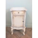 A ornately painted bedside cabinet in French antique style