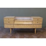 A 1960's cream laminated sideboard