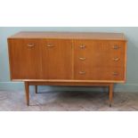 A Uniflex sideboard with three drawers and two cupboard doors