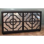 A Julian Chichester "Anna" ebonised oak sideboard with mirrored doors