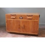 A substantial vintage shop unit with two door cupboard below a single drawer