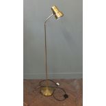 An adjustable gold spot light floor lamp.