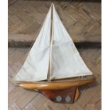 A vintage wooden hull pond yacht