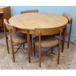 A 1960's circular dining table and four chairs