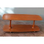 An unusual twin pedestal coffee table on castors