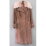 A long suede coat with furry collar