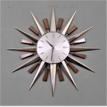 A Metamec 'starburst' or 'sunburst' wall clock with original guarantee dated 1972