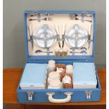 A vintage picnic set in blue hard case