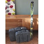 Two 1970's grey suitcases and a pair of Fischer skis