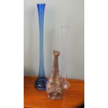 Two art glass vases and clawed obelisk ceramic