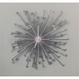 A Habitat wall clock in the form of starburst keys