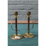 A pair of Arts and Crafts brass and wood candlesticks with bobbin turned stems,