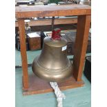 A brass ships bell with George 6th insignia and crown to top