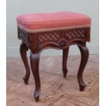 A late 19th Century mahogany piano stool on cabriole legs with patent rise and fall action by Chas