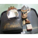 A small bevel glass toilet mirror with plaster flower decoration, a Japanese lacquer games box,