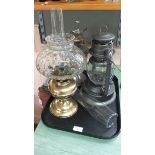 Two oil lamps plus a storm lantern