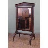 A George IV mahogany cheval mirror, on turned tapering columns,