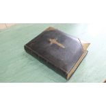 A 19th Century family Bible with brass work