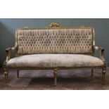 A late 19th Century French gilt sofa with suede upholstery