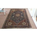 A multi-colour Persian rug,