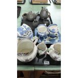 A set of three 'Mine' pattern Staffordshire graduated jugs, a Willow pattern part tea set,