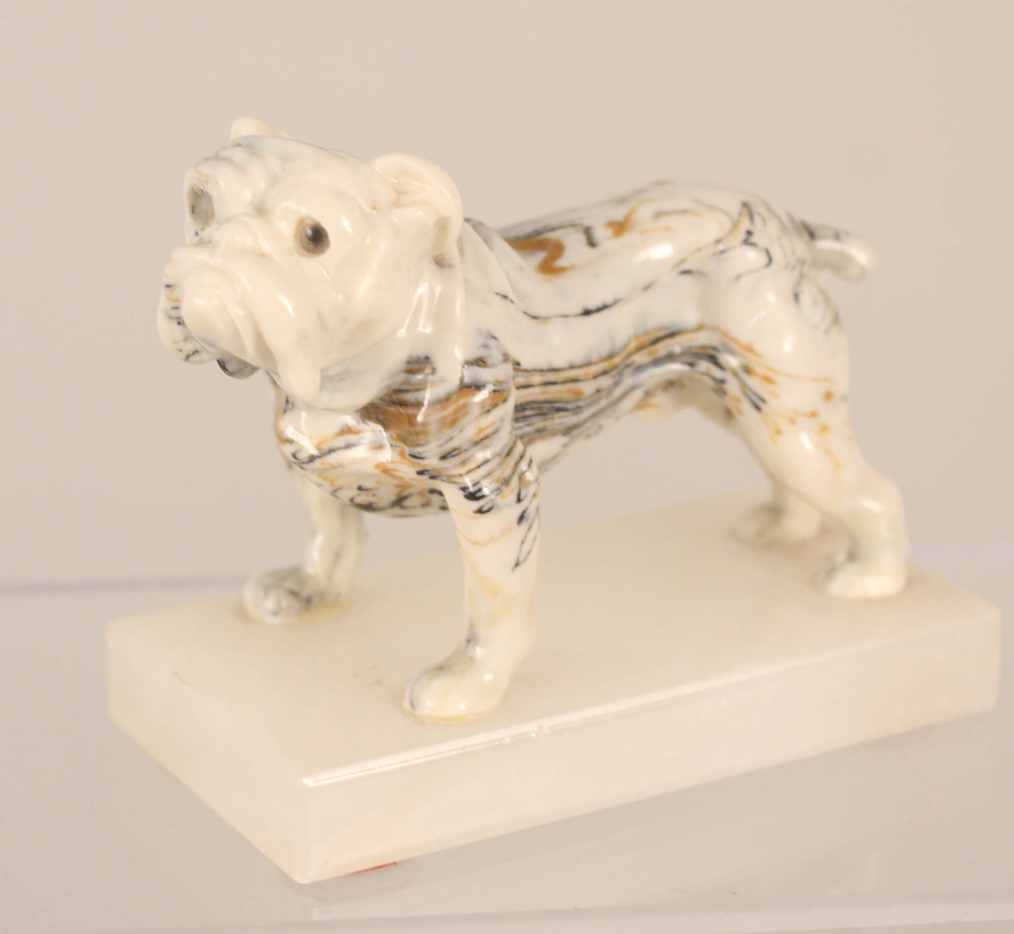 A slip ware bulldog on base,