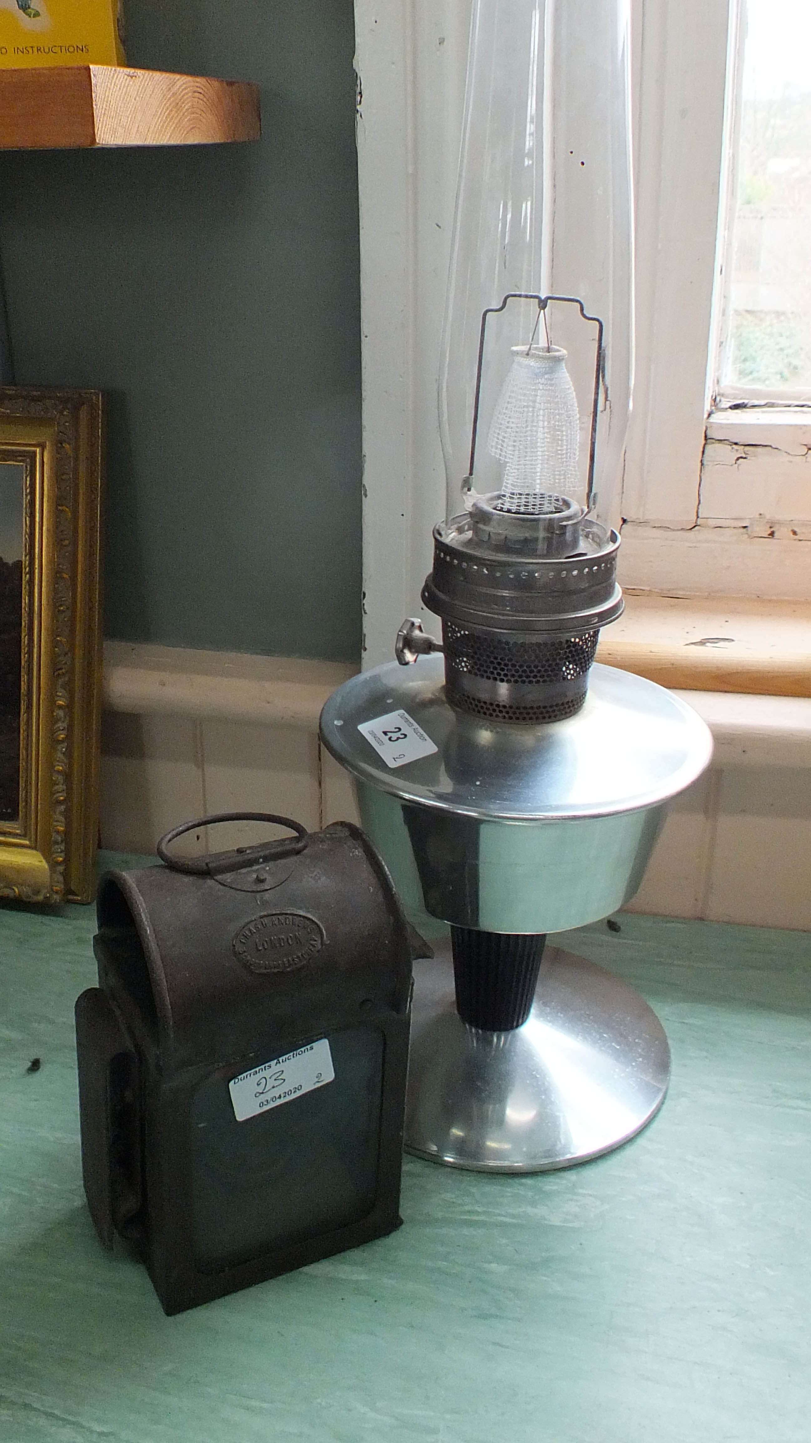 A paraffin carriage lamp by Chas Andrews London plus a 1960's Aladdin chrome oil lamp