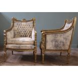 A pair of late 19th Century French gilt armchairs with suede upholstery