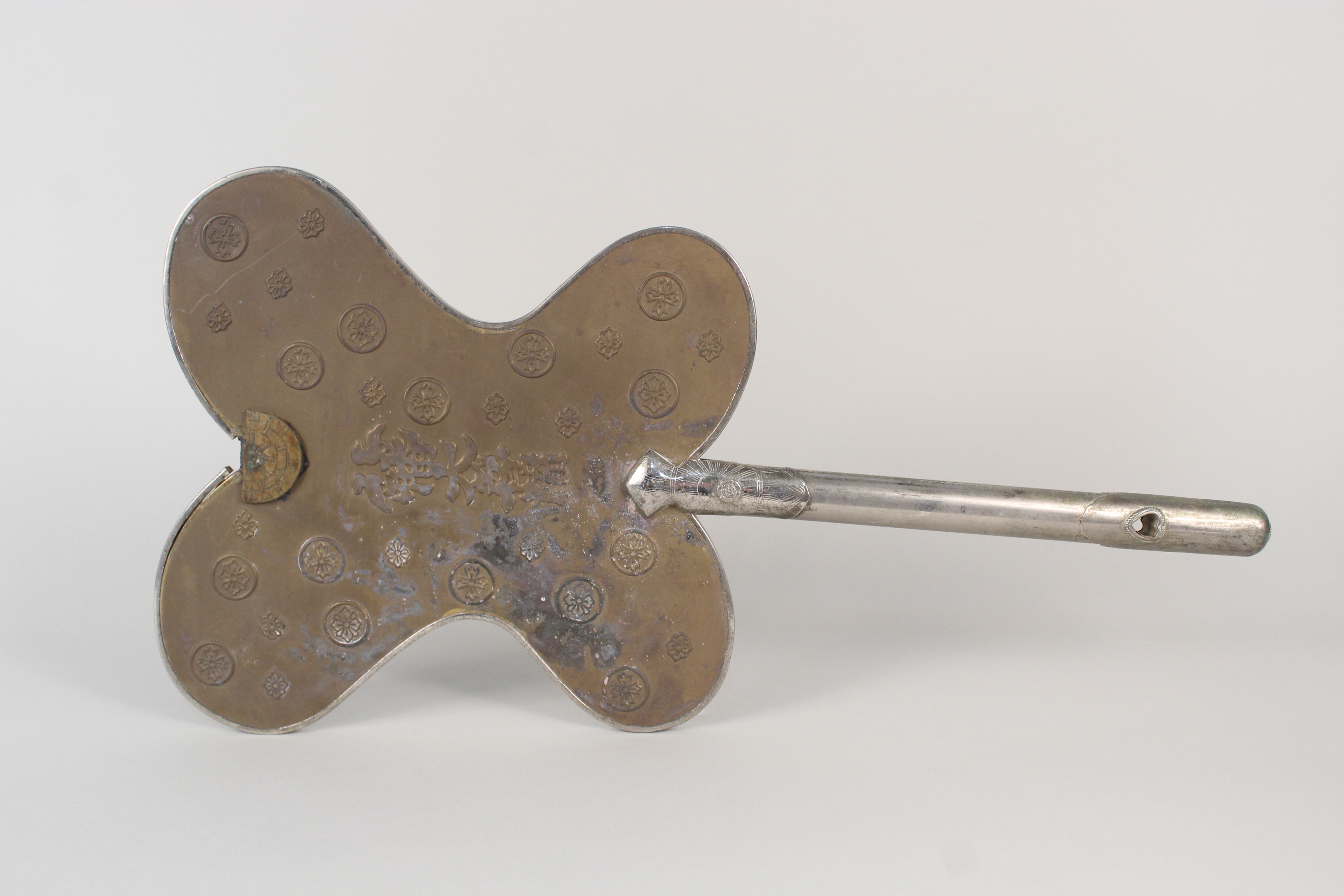 A late 19th Century Japanese white metal and brass ceremonial fan