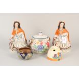 A Clarice Cliff honey pot, a Poole pottery biscuit barrel,