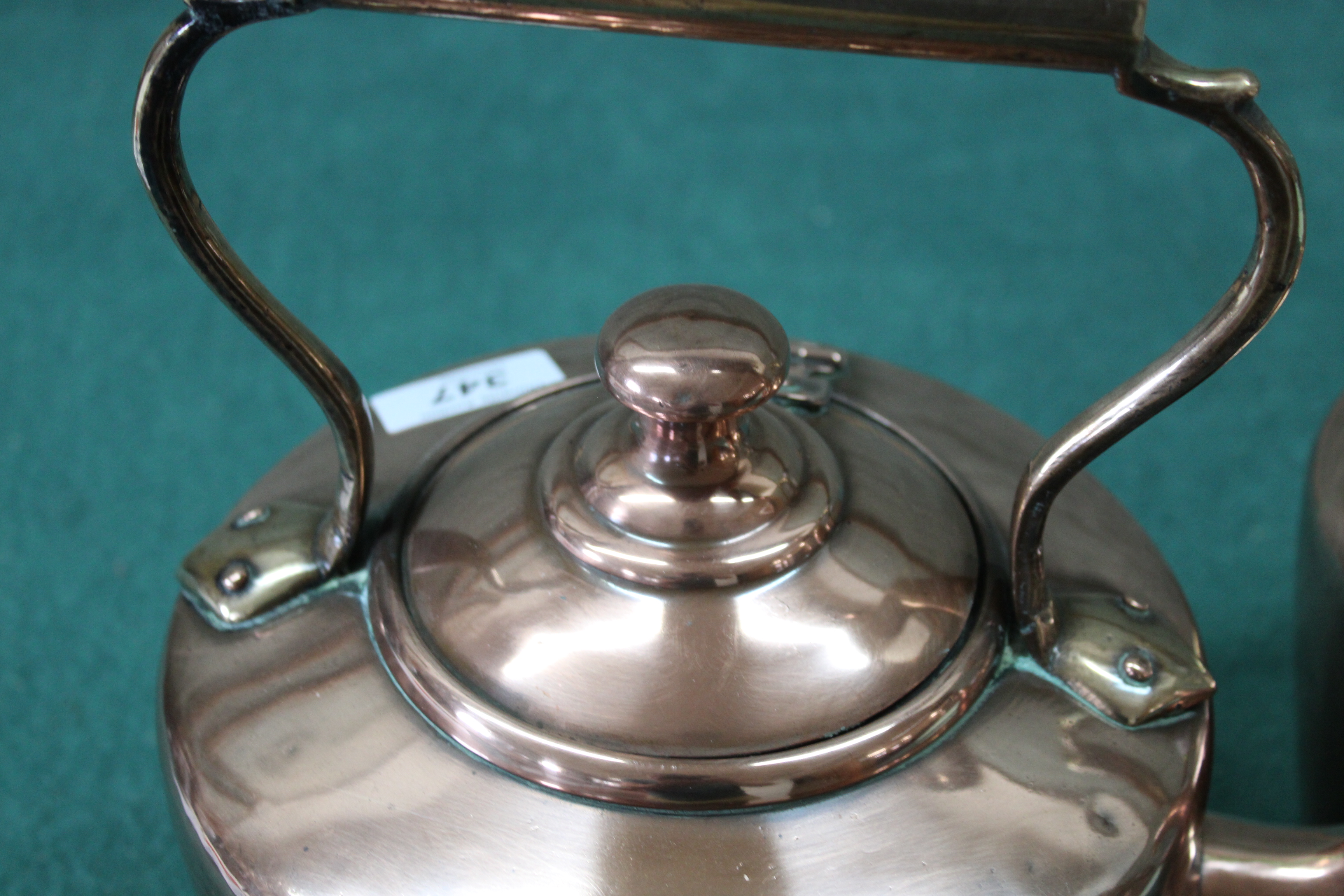 Two Victorian seamed copper kettles, one circular with hinged lid and the other oval, - Image 2 of 3