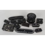 A collection of ebonised and inlaid snuff and trinket boxes