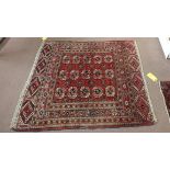 A red ground rug with asymmetric pattern,