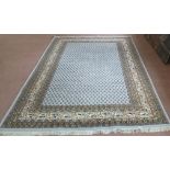 An oriental style blue ground rug,