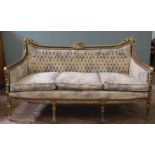 A late 19th Century French gilt sofa with suede upholstery