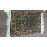 A small silk Persian rug,