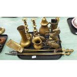 A tray of assorted brass ware including a pair of Victorian candlesticks,